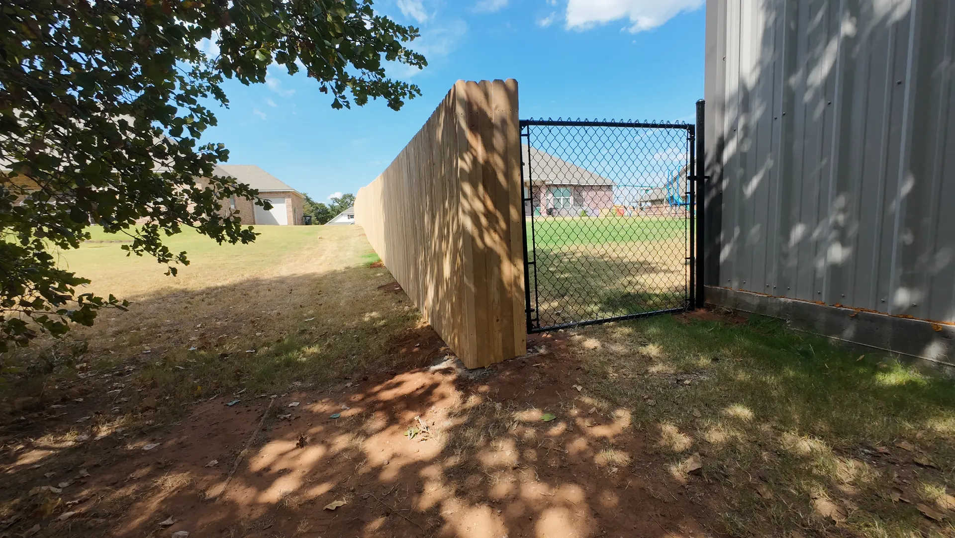 Cedar Fence and Black Chain Link Gate